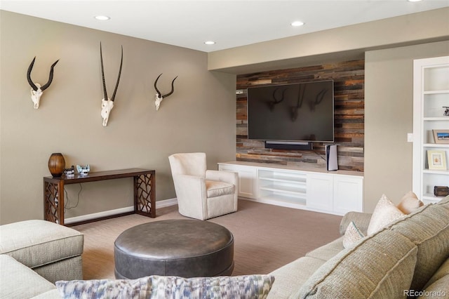 living area featuring recessed lighting and carpet