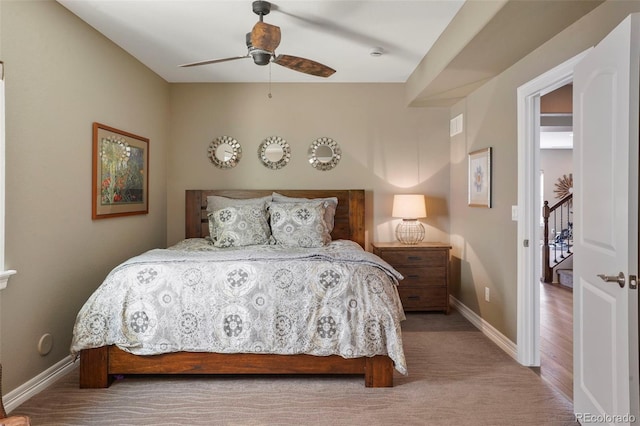 bedroom featuring carpet flooring, a ceiling fan, and baseboards