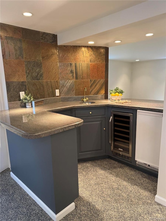 indoor wet bar with wine cooler, carpet, recessed lighting, and tasteful backsplash
