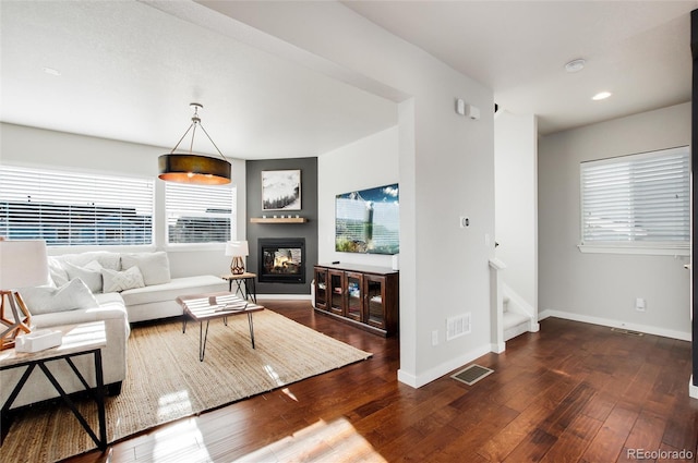 living room featuring dark hardwood / wood-style flooring