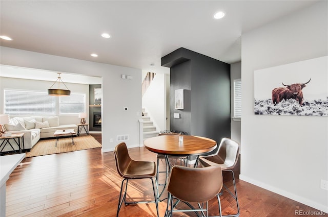 dining room with hardwood / wood-style flooring