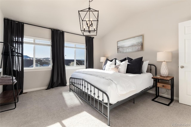 bedroom featuring vaulted ceiling, light colored carpet, and a notable chandelier