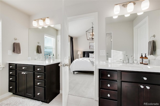 bathroom with tile patterned floors and vanity