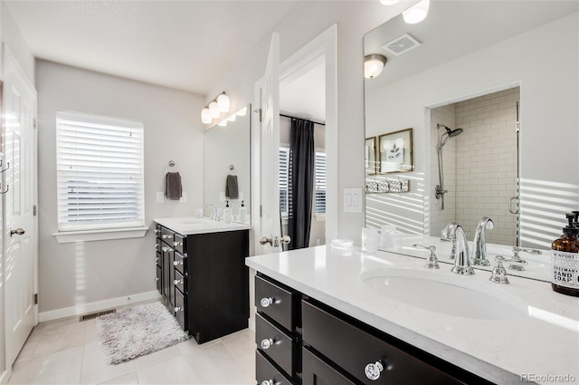 bathroom with tile patterned flooring and vanity