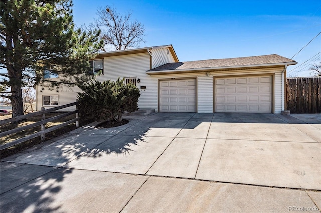 exterior space with driveway and fence