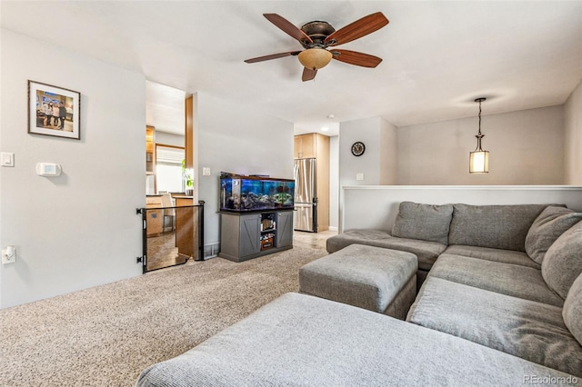 living room with light colored carpet and a ceiling fan