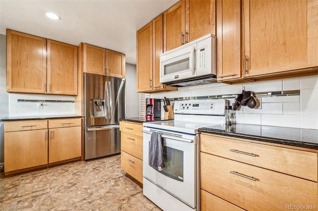 kitchen featuring white appliances, recessed lighting, and tasteful backsplash