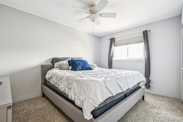 bedroom featuring a ceiling fan and carpet