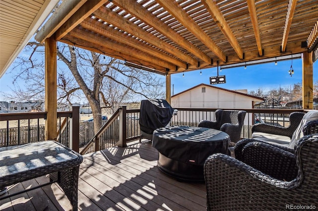 wooden terrace with a pergola and grilling area