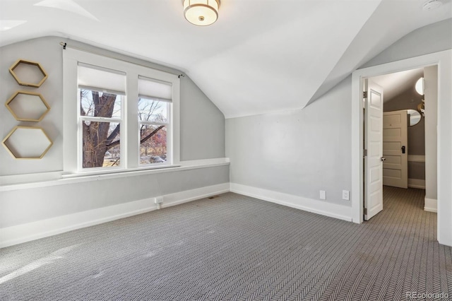 1626 Albion St, Denver, CO 80220 - additional living space featuring carpet floors, vaulted ceiling, and baseboards