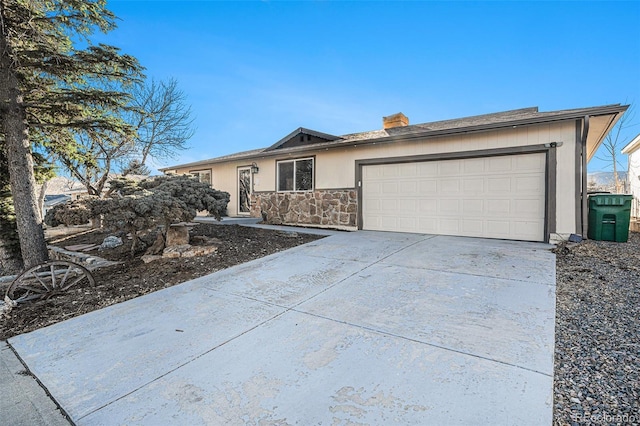 ranch-style home featuring a garage, stone siding, driveway, and stucco siding