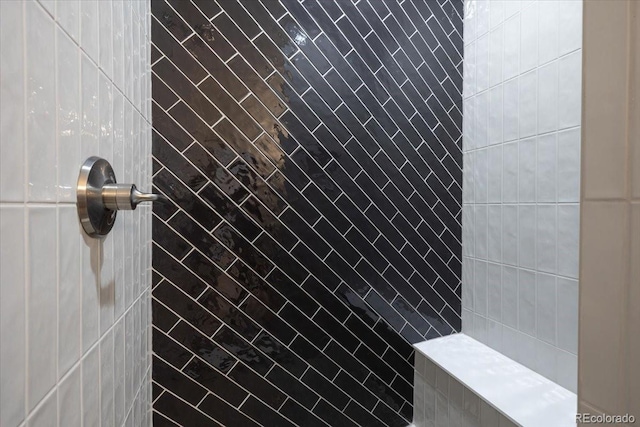 bathroom with a tile shower