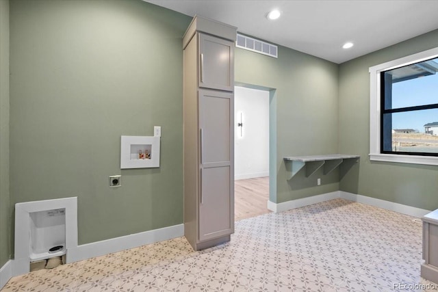 laundry room with cabinets, washer hookup, and hookup for an electric dryer