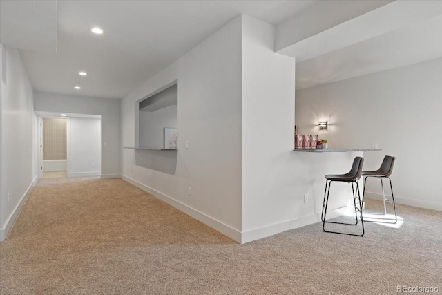 corridor with light colored carpet