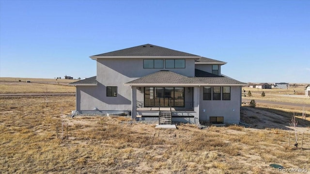 rear view of property featuring a rural view