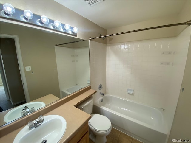 full bath featuring tile patterned floors, visible vents, toilet, bathing tub / shower combination, and vanity