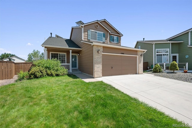 view of front facade featuring a front lawn and a garage