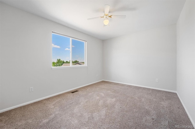 unfurnished room featuring carpet and ceiling fan