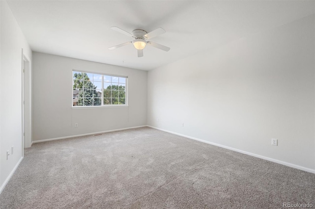 spare room with ceiling fan and carpet floors