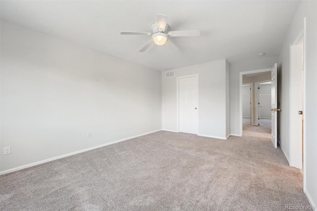 unfurnished bedroom with a closet, ceiling fan, and light carpet