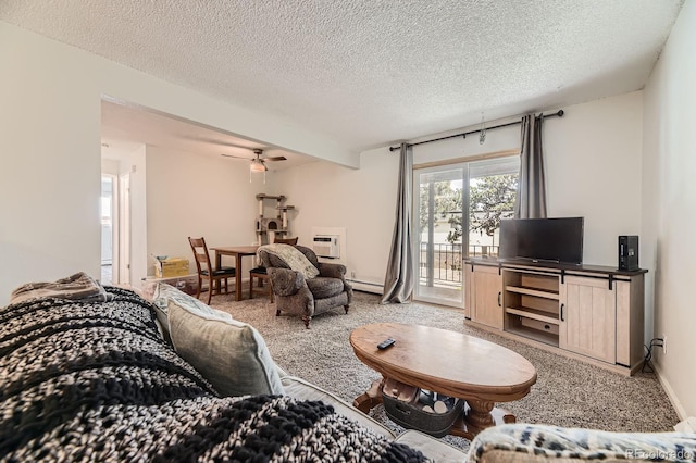 4653 S Lowell Blvd Unit E, Denver, CO 80236 - living area featuring carpet flooring, a textured ceiling, a baseboard heating unit, and ceiling fan