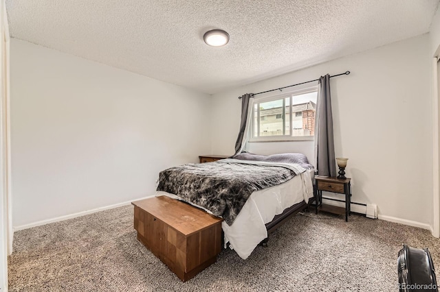 4653 S Lowell Blvd Unit E, Denver, CO 80236 - carpeted bedroom with a textured ceiling, a baseboard heating unit, and baseboards