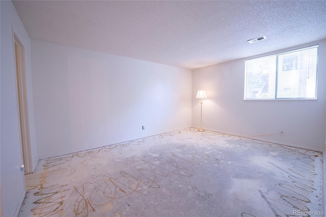 12506 E Cornell Ave Unit 102, Aurora, CO 80014 - spare room with a textured ceiling
