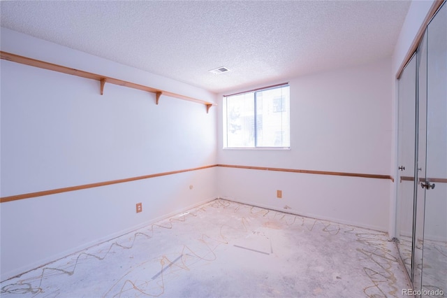 12506 E Cornell Ave Unit 102, Aurora, CO 80014 - empty room featuring a textured ceiling and light carpet