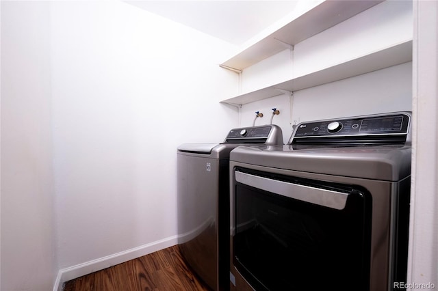 12506 E Cornell Ave Unit 102, Aurora, CO 80014 - laundry room with washing machine and dryer and wood finished floors