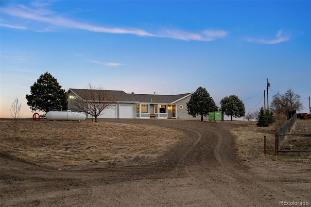 view of front of house featuring fence and an attached garage