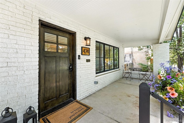 474 S Vine St, Denver, CO 80209 - property entrance with a porch and brick siding