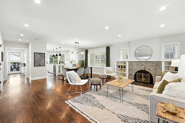 474 S Vine St, Denver, CO 80209 - living area featuring dark wood-style flooring, a fireplace, recessed lighting, a chandelier, and wine cooler