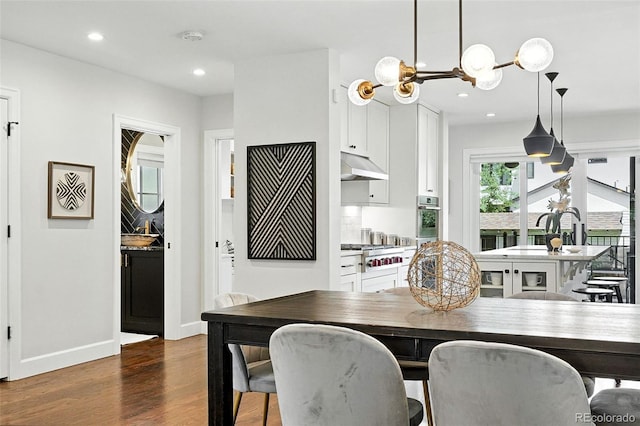 474 S Vine St, Denver, CO 80209 - dining room with dark wood-style flooring, recessed lighting, and a chandelier