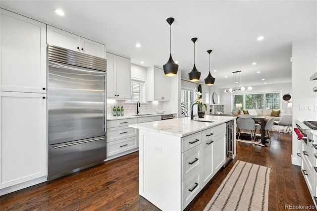 474 S Vine St, Denver, CO 80209 - kitchen featuring built in fridge, open floor plan, dark wood-style flooring, wine cooler, and recessed lighting