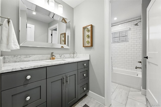 474 S Vine St, Denver, CO 80209 - full bathroom featuring vanity, marble look tiles, shower / tub combination, and recessed lighting