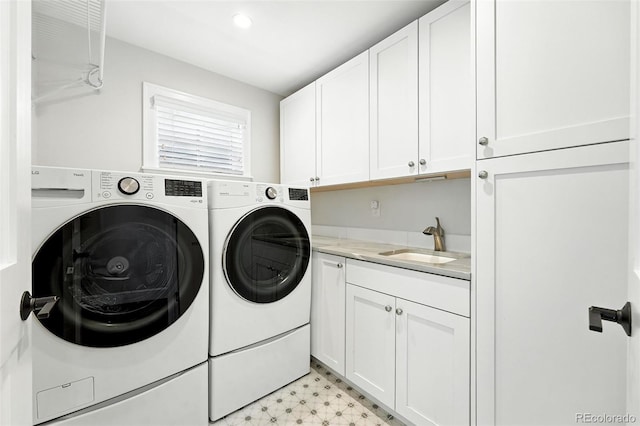 474 S Vine St, Denver, CO 80209 - laundry room featuring separate washer and dryer, cabinet space, and light floors