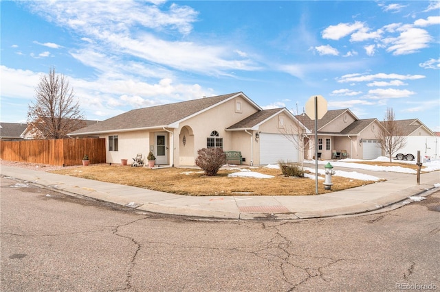 single story home featuring a garage