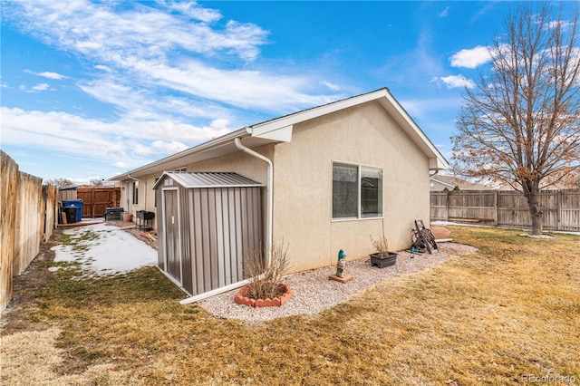 view of side of home featuring a yard