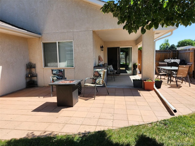 view of patio featuring a fire pit