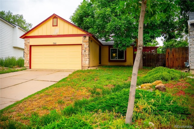 7961 Jared Way, Littleton, CO 80125 - single story home featuring stone siding, a garage, board and batten siding, and concrete driveway