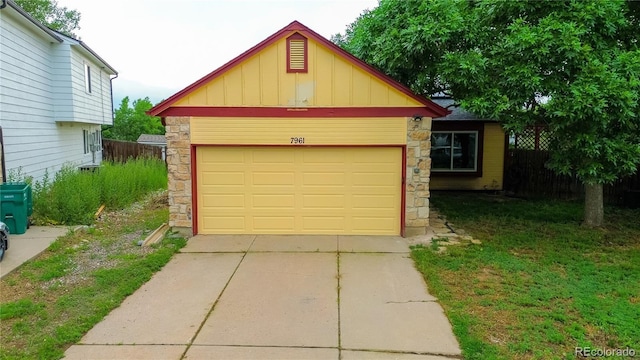 7961 Jared Way, Littleton, CO 80125 - garage featuring driveway