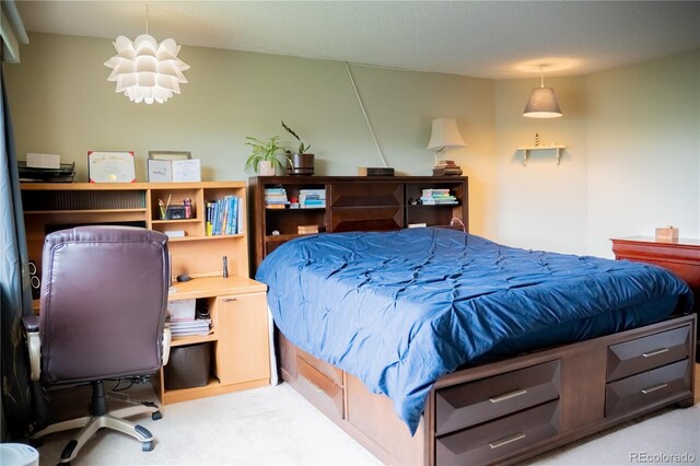 7961 Jared Way, Littleton, CO 80125 - bedroom featuring carpet floors, an office area, and a chandelier