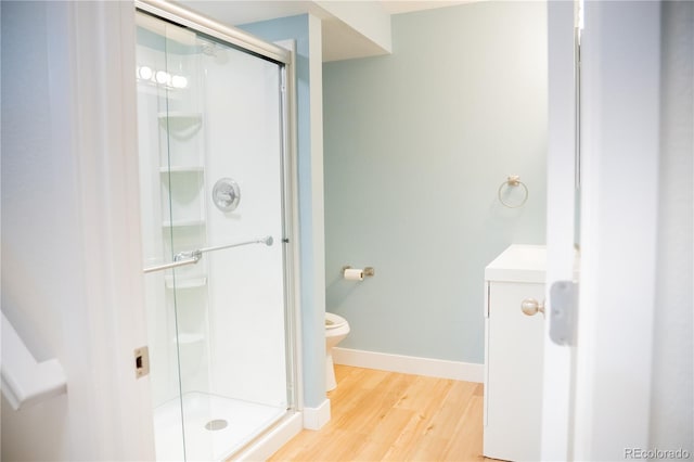 7961 Jared Way, Littleton, CO 80125 - bathroom featuring a stall shower and wood finished floors