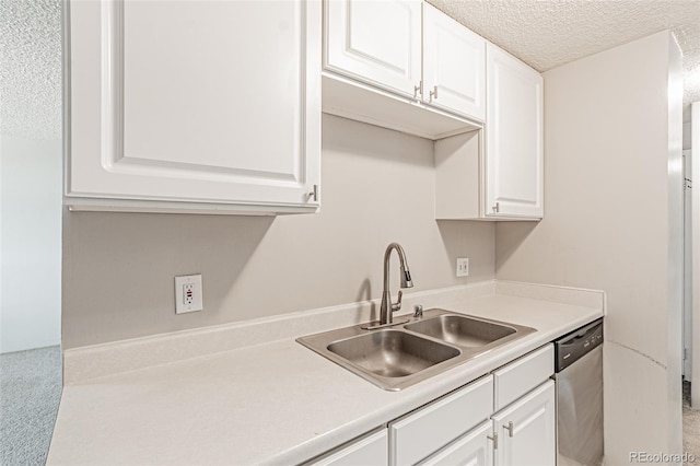 2225 Buchtel Blvd Unit 1005, Denver, CO 80210 - kitchen featuring stainless steel dishwasher, a sink, a textured ceiling, white cabinets, and light countertops