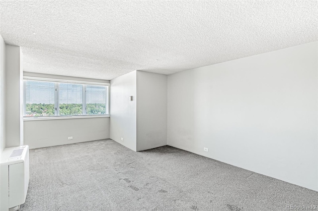 2225 Buchtel Blvd Unit 1005, Denver, CO 80210 - unfurnished room featuring carpet flooring and a textured ceiling