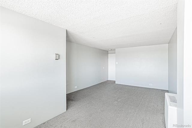 2225 Buchtel Blvd Unit 1005, Denver, CO 80210 - carpeted empty room featuring a textured ceiling