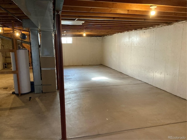 basement with gas water heater and heating unit