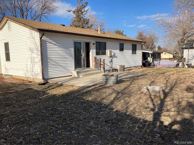 back of house with a patio area and central AC