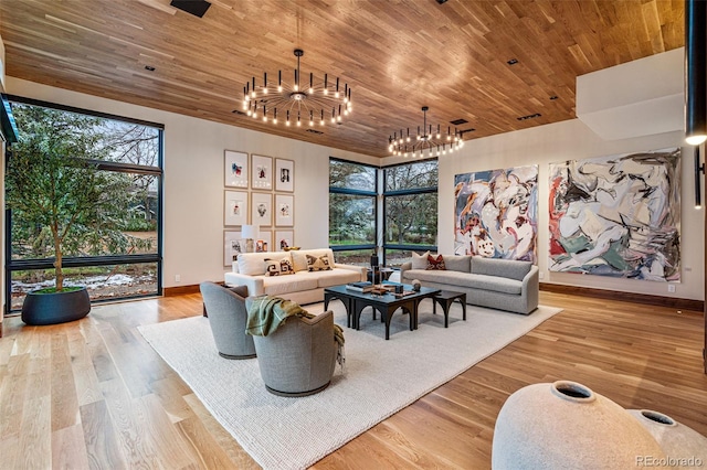 living room with light hardwood / wood-style floors, an inviting chandelier, and wooden ceiling