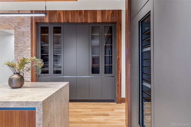 kitchen featuring hanging light fixtures and light hardwood / wood-style flooring